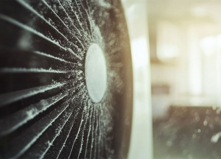 Dusty fan blades in a home setting, highlighting potential air quality issues related to mold and humidity in Payson, AZ.